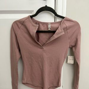 Free people long sleeve it a rose gold/ pink color